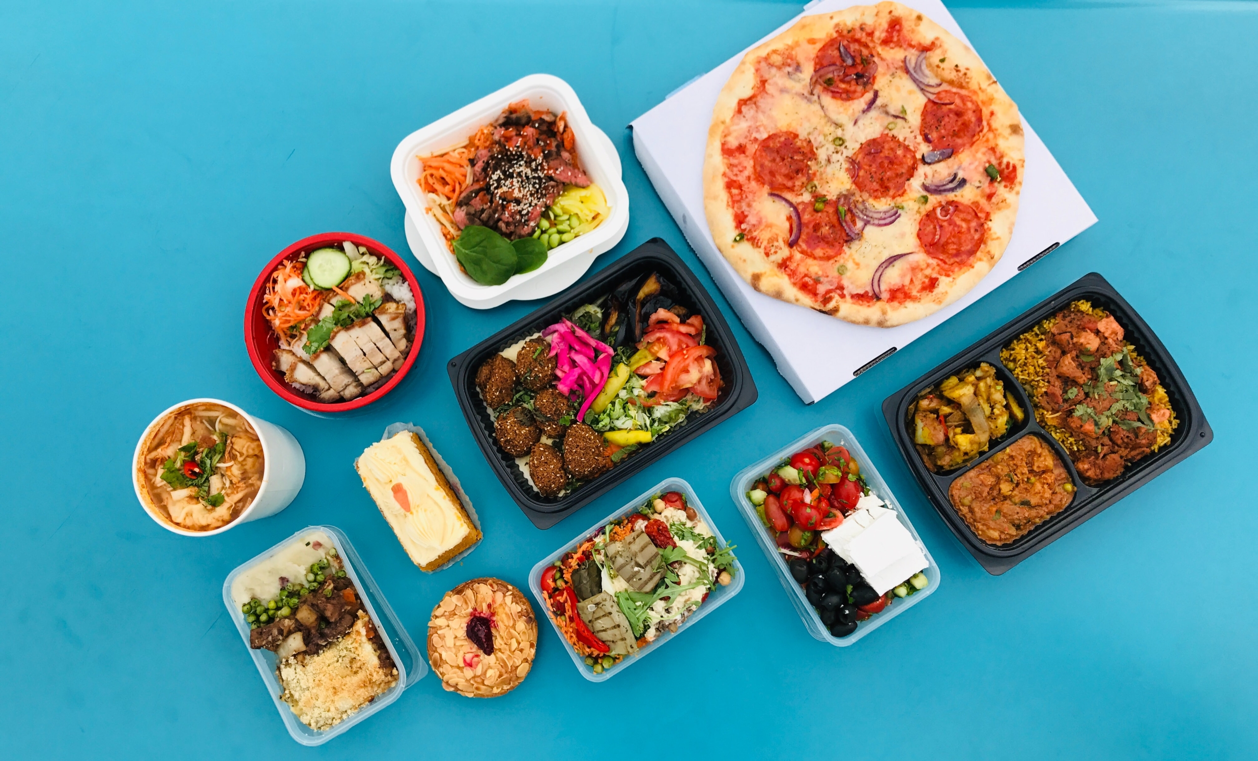 Variety of food and dishes on a blue background