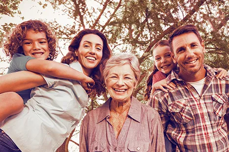 Family outside smiling