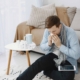Man sneezing next to allergy medication at a Florida home