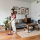 Woman vacuuming to remove dust mites and reduce allergy symptoms