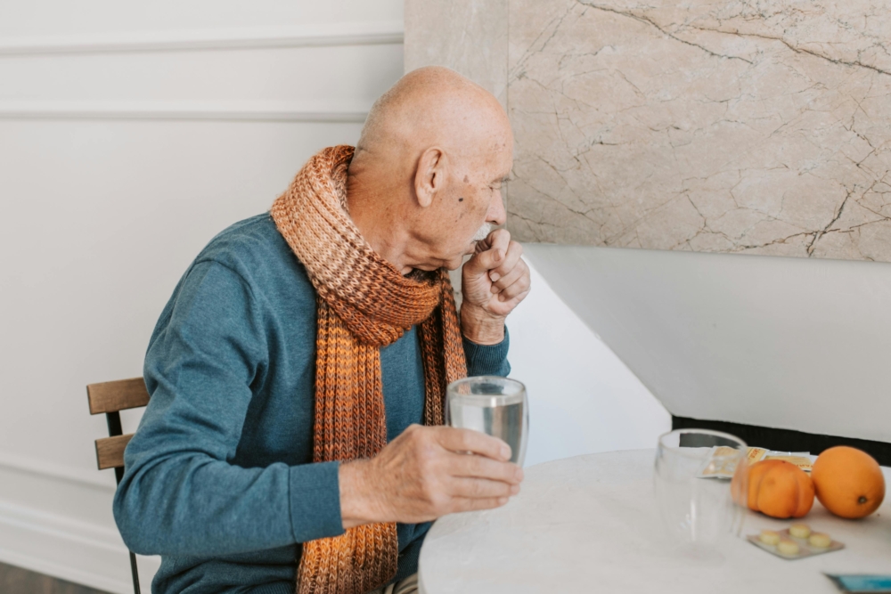  Elderly man in need of an allergy and asthma specialist appointment to treat his chronic cough.