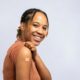 Woman smiling after receiving an allergy shot to treat her allergy symptoms